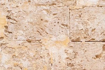 Abstract background of a sandstone brick on a wall of an old building in Europe