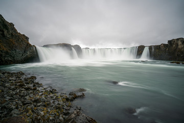 Closeup shot of Godafoss waterfall near Akureyri in the Icelandic highlands.  Icelandic and traveling concept.