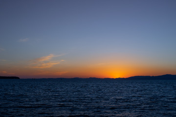 Seascape with sunset on the horizon. Vladivostok, Russia