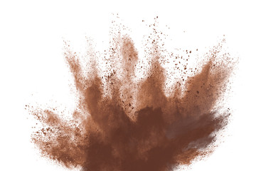 Brown color powder explosion isolated on white background. Colored cloud. Colorful dust explode....