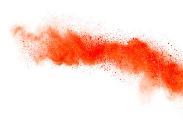 Orange powder explosion isolated on white background.