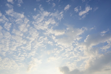 fluffy cloud above blue sky with sunlight in the morning