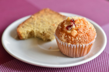 Cupcake in a white plate on table for breakfast.