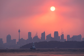 Sydney, Australia - 4th January 2020. The setting sun through the smoke haze of New South Wales...