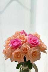 arrangement romantic bouquet orange and pink rose blossom flower in vase with sunlight in the morning day