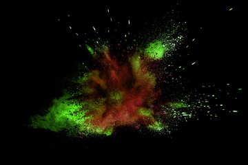 Multicolor powder explosion isolated on black background.