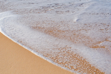 Sea foam from a wave on the ocean. Background. Close up.