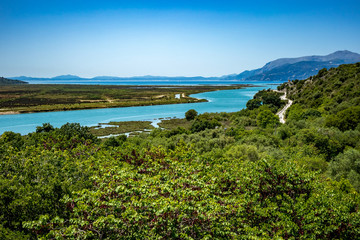 Naklejka na ściany i meble High angle sunny spring day view of salt lagoon lake in the national park of Butrint in Albania, Europe