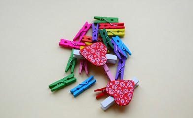 A clothespin  or clothes peg is a fastener used to hang up clothes for drying, usually on a clothes line. Clothespins often come in many different designs