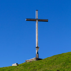 Summit Cross of Mount Rauheck, 1590 m in Bavarian Prealps, located near Ohlstadt, Upper Bavaria, Germany. Europe