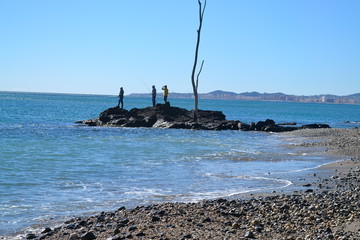 Fishermen on rock