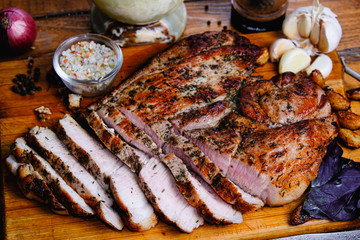 roasted ham composition on a wooden background