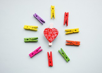 A clothespin  or clothes peg is a fastener used to hang up clothes for drying, usually on a clothes line. Clothespins often come in many different designs