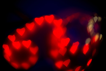 Valentine's Day abstract background. Blurred bokeh with colorful hearts