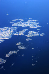 Fototapeta na wymiar Aerial View of Icebergs and the Coastline of Labrador, Canada