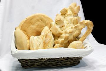 Wicker basket with different types of bread.