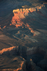 First Sun Rays of the Day illuminating a Rock Formation in the Grand Canyon National Park, AZ, USA
