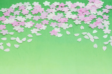 和紙で表現した桜吹雪（背景グラデーション・花吹雪・サクラ・さくら・花びら・ハート形・４月・春）