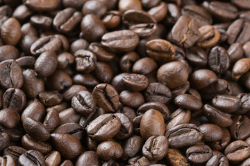 roasted coffee beans scattered on the table