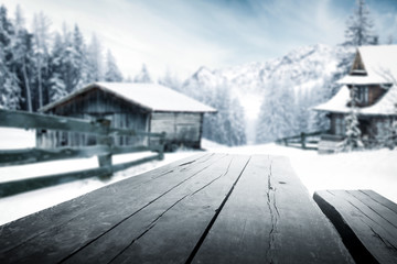 Wooden table of free space and winter rural background. 