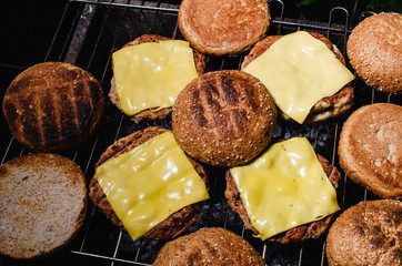 chicken burger composition on a bbq grill