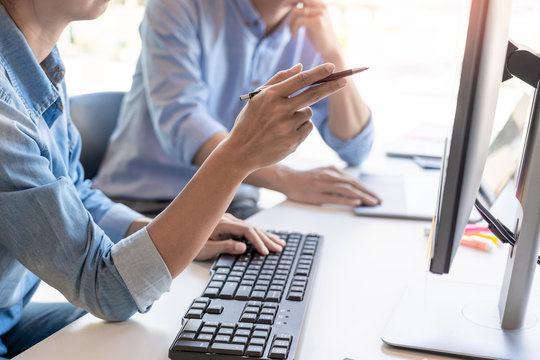 Pensive programmer working on on desktop pc programming code technologies or website design at office Software Development Company