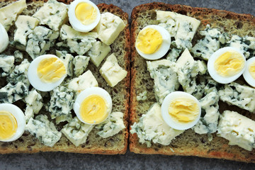 Keto diet. Toast with blue cheese and quail eggs. Keto toasts. Healthy snack.