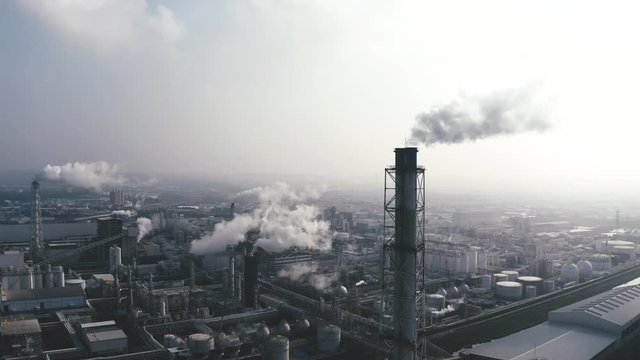 Aerial view of industrial area with chemical plant. Smoking chimney from factory