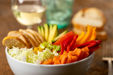 buddha bowl with chicken on wood