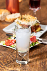 greek salad with moussaka on wood
