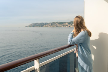 Fototapeta premium Cruise ship vacation. Teenager girl relaxing on luxury cruise ship balcony