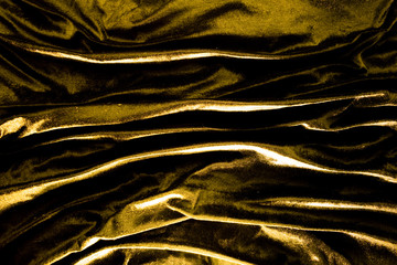 Gold luxury satin fabric texture and shadow for background