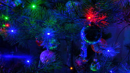 Christmas tree with illumination decorated with balls and other Christmas tree decorations