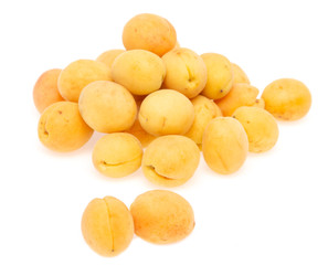 Fototapeta na wymiar fresh yellow apricots against white background