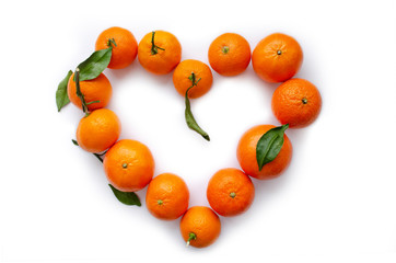 Heart shaped mandarin oranges frame on white isolated background.