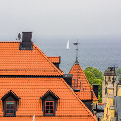 Sail over old tile Roofs of Visby. Gotland. Sweden