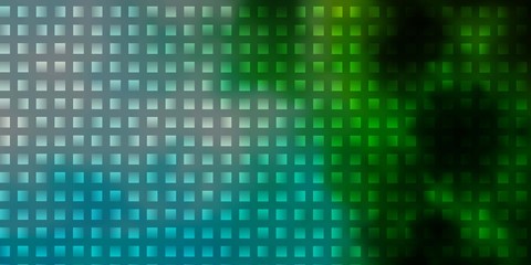 Obraz premium Light Blue, Green vector background in polygonal style.