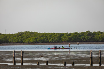 Fishers and small long boats. Fadiauth Island. Senegal. West Africa.