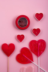 Shiny white and red heart shape balloons and tiny heats.