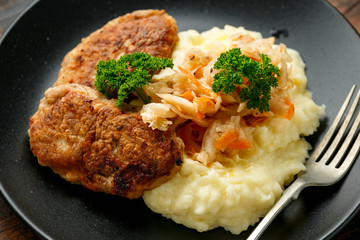 Home made minced meat patties, cutlets served with mashed potatoes and sour kraut. Traditional Russian food