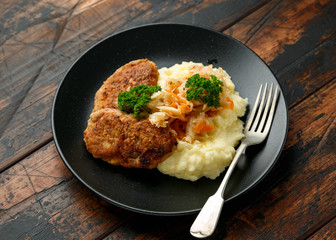 Home made minced meat patties, cutlets served with mashed potatoes and sour kraut. Traditional Russian food