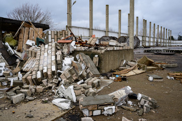 The concept of trash environmental disaster. Photo of a landfill on a street in a city on a cloudy...