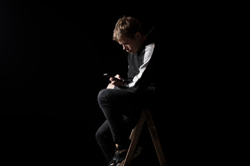 Young man in a sports suit with a smartphone