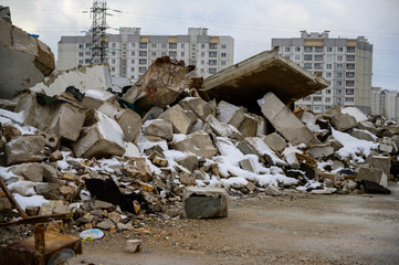 The concept of trash environmental disaster. Photo of a landfill on a street in a city on a cloudy...