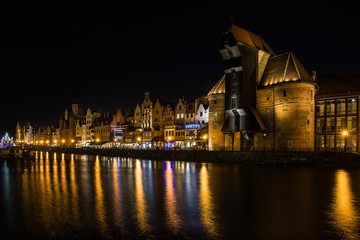 Fototapeta na wymiar Old town of Gdansk with ancient crane at night, Poland