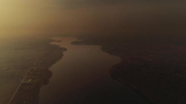 Dramatic, dark, misty lake landscape. Polish longest lake at Masuria, Jeziorak at sunset. Drone, aerial footage.