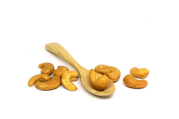 Cashew nut on wooden spoon isolated white background - healthy nutrients  food concept 