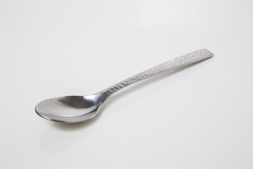 steel spoon silver placed on an isolated background,..The equipment for the kitchen dishware meal breakfast,