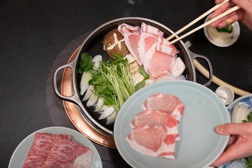Meat beef slice and fresh vegetables in pot of  Sukiyaki or Shabu shabu.