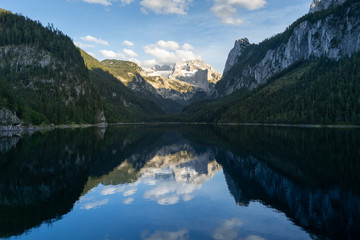 Fototapeta premium Lake Gosausee is one of the most beautiful places in Austrian Alps, The scenery around is just breathtaking, you can see beautiful mountains around and also the Dachstein glacier. Tourism in Austria